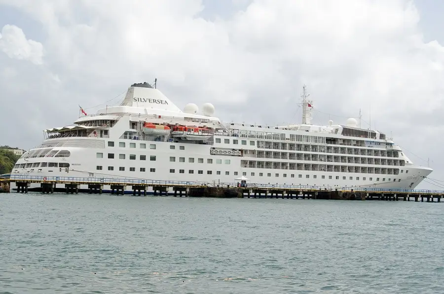 Cruise ship docked at port, representing sanitation concerns highlighted in CDC's dirtiest cruise ships list.