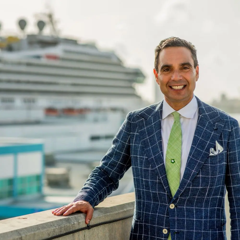 Maritime attorney Spencer Aronfeld in front of a cruise ship, legal expert in cruise line litigation.