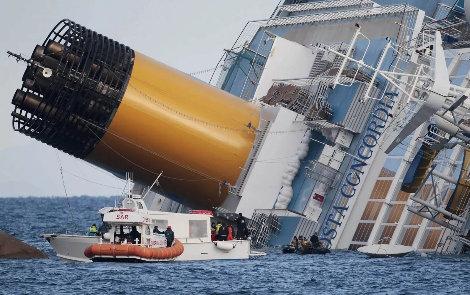 Costa Concordia cruise ship sinking and rescue efforts following maritime injury incident.
