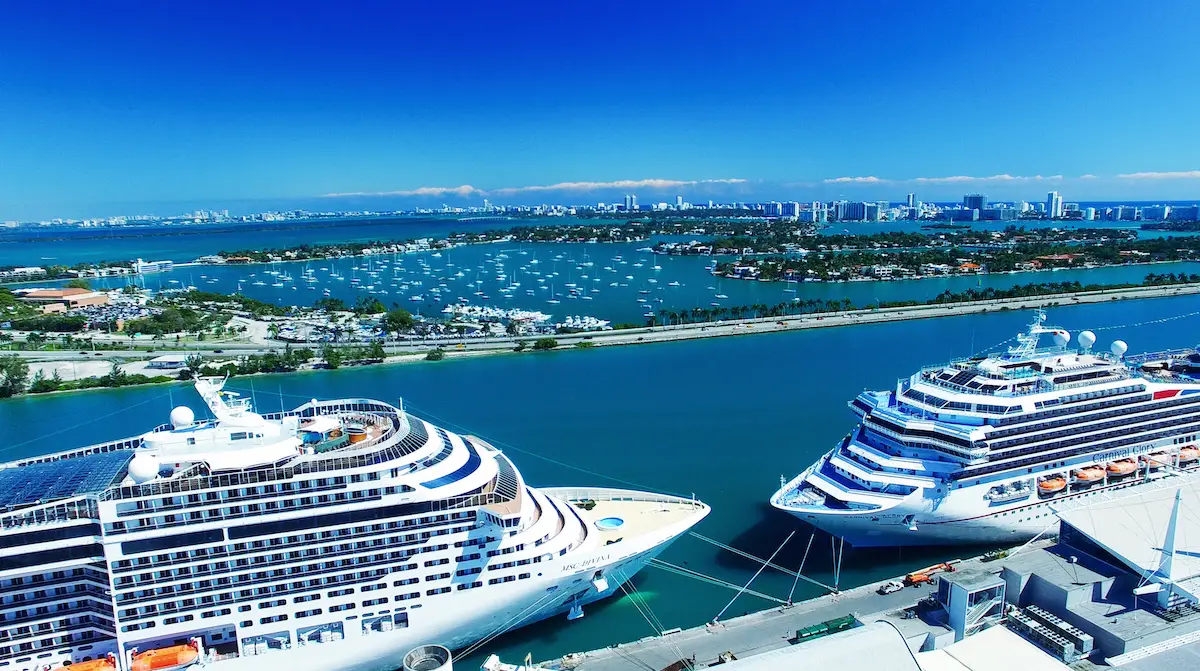 Cruise ships docked at Port Canaveral with a scenic waterfront view, highlighting the upcoming cruise departures and maritime activities.