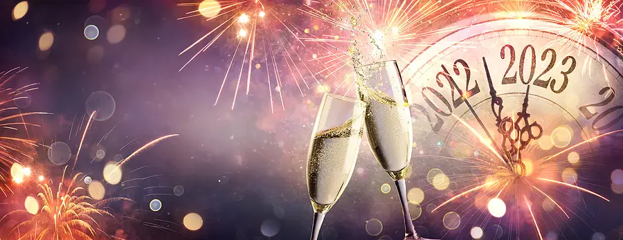 Champagne glasses toasting with fireworks and a clock striking midnight, celebrating New Year's Eve 2023.