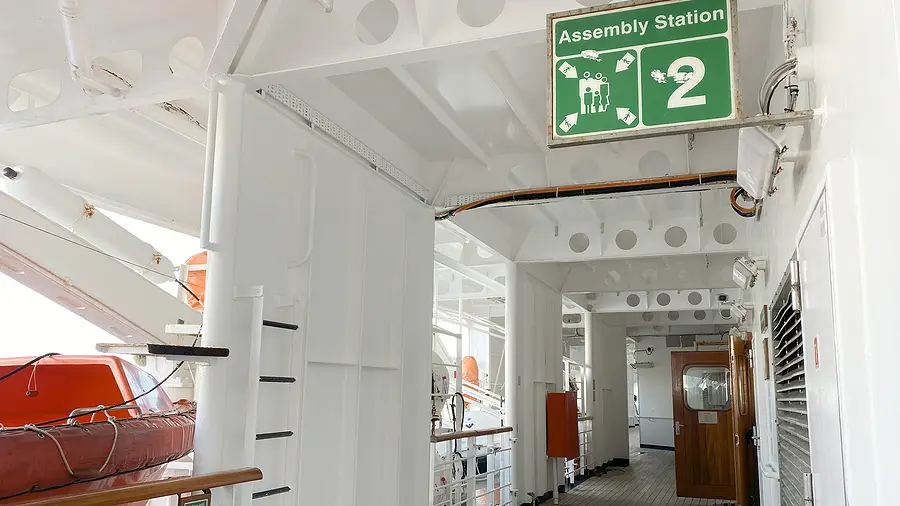 Assembly station sign number 2 on a cruise ship, indicating safety procedures and emergency protocol.