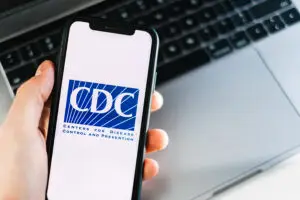 cdc centers for disease control and prevention logo on smartphon