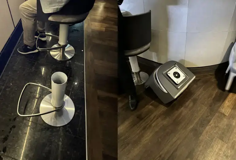 Faulty chair with detached base at sushi bar on Ritz-Carlton yacht Evrima, highlighting dangerous condition related to passenger injury lawsuit.