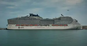 Doha, Qatar - January 5 2023: Old Doha port (Mina District) afternoon shot showing cruise ship ( MSC World Europa) .