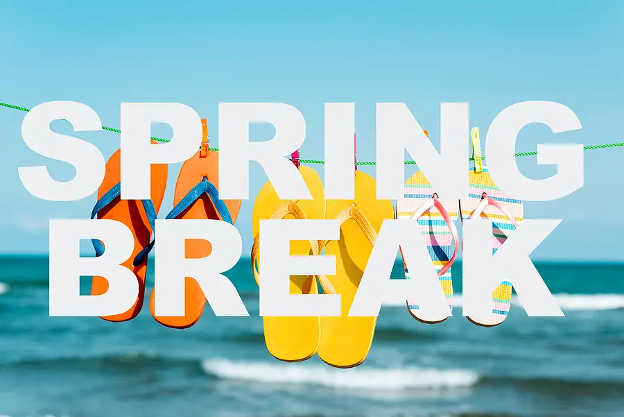 Colorful flip-flops hanging on a line with the text 