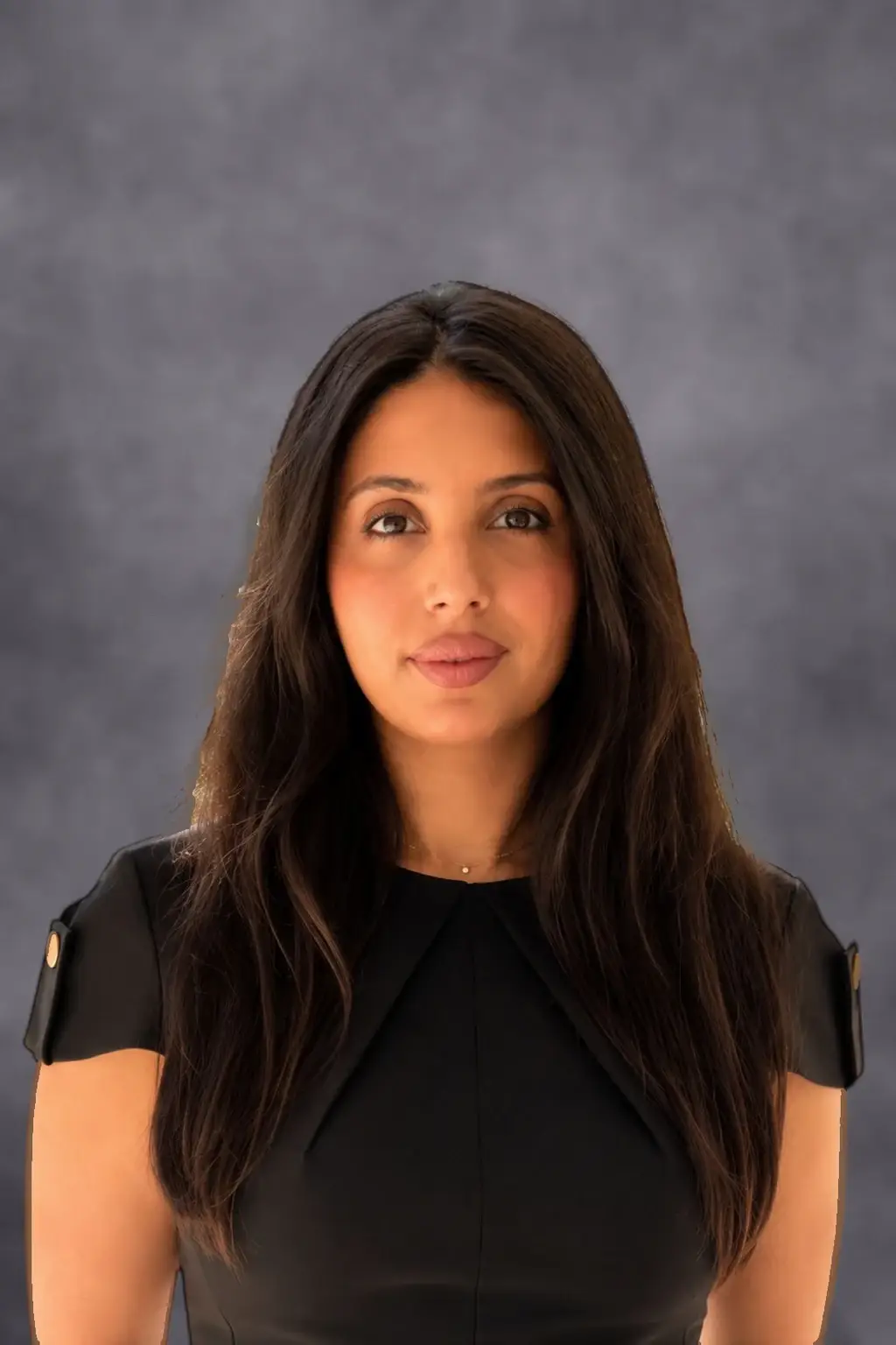 Sara Rose Aronfeld, Esq., attorney at Aronfeld Trial Lawyers, wearing a black dress against a gray studio background.